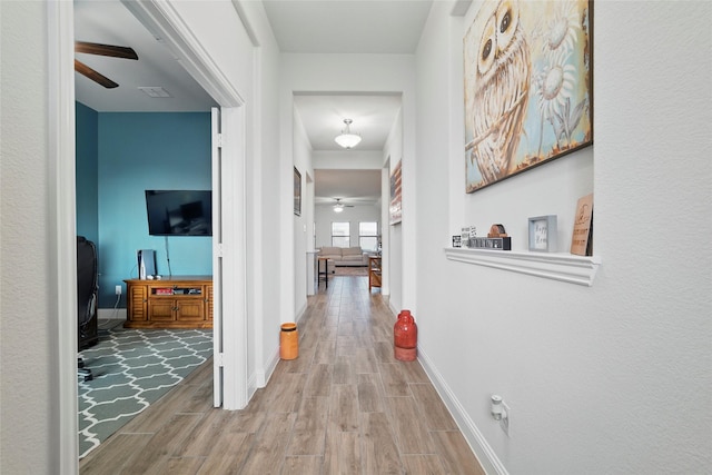 2109 Liriope Ln, Waxahachie, TX 75165 - hallway featuring wood finished floors and baseboards