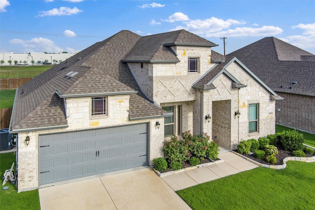 2109 Liriope Ln, Waxahachie, TX 75165 - french country style house with roof with shingles, stone siding, driveway, and cooling unit
