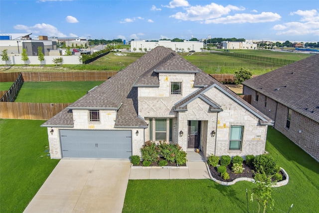 2109 Liriope Ln, Waxahachie, TX 75165 - view of front facade featuring roof with shingles, stone siding, driveway, and a garage