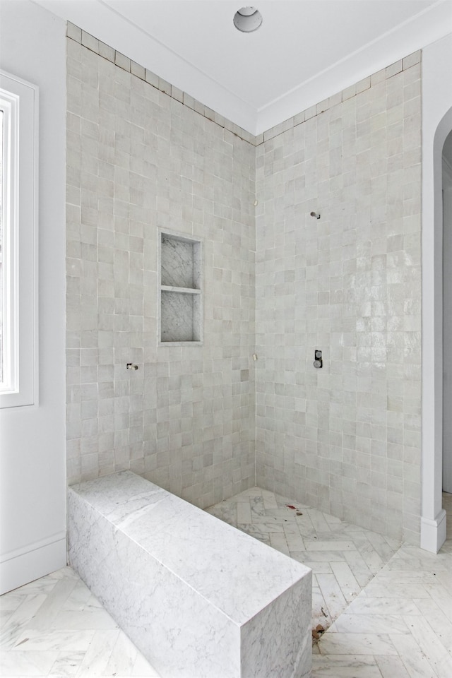 6207 Marquita Ave, Dallas, TX 75214 - bathroom with a tile shower and marble finish floors