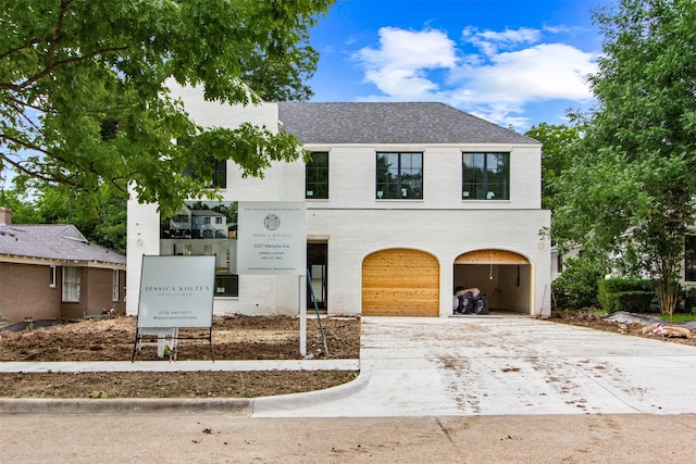 6207 Marquita Ave, Dallas, TX 75214 - view of front of house with concrete driveway, brick siding, an attached garage, and roof with shingles