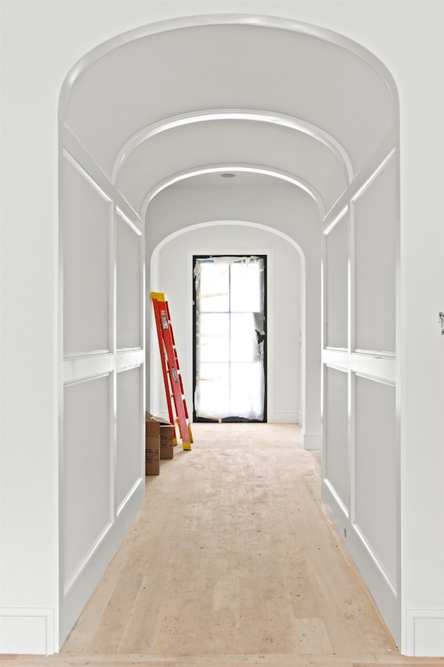 6207 Marquita Ave, Dallas, TX 75214 - corridor featuring arched walkways and wood finished floors