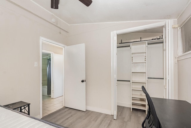 1705 Jefferson St, Commerce, TX 75428 - unfurnished bedroom featuring wood finished floors, a closet, and ceiling fan