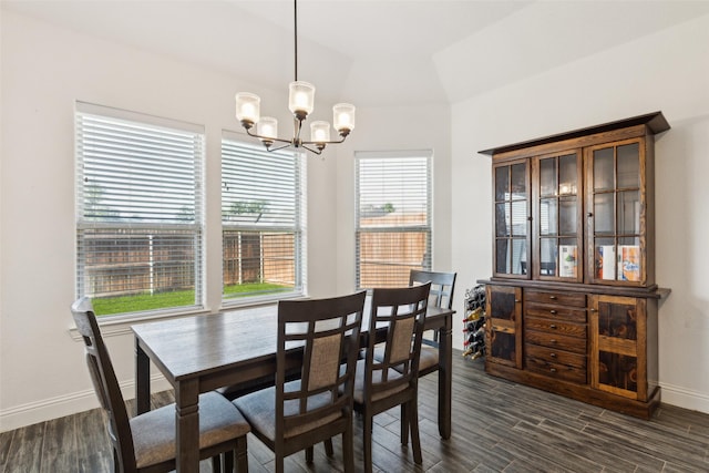 900 E 5th St, Springtown, TX 76082 - dining space with a chandelier, baseboards, and dark wood-style floors
