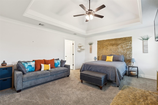 900 E 5th St, Springtown, TX 76082 - bedroom featuring a raised ceiling, carpet, crown molding, ceiling fan, and baseboards