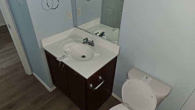 5833 Mirror Ridge Dr, Fort Worth, TX 76179 - bathroom with vanity, wood finished floors, toilet, and baseboards
