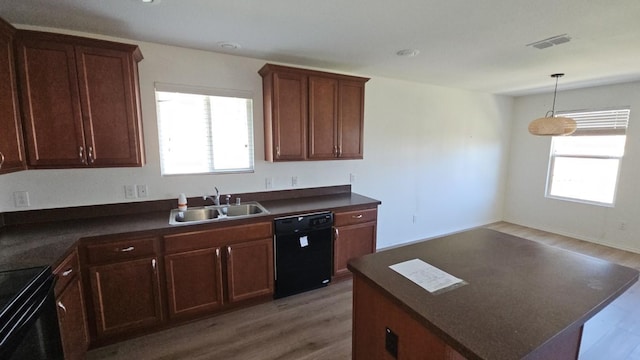5833 Mirror Ridge Dr, Fort Worth, TX 76179 - kitchen with black appliances, a sink, dark countertops, and light wood-style floors