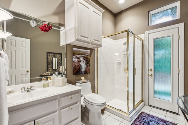 600 Loving Ct, Southlake, TX 76092 - bathroom with a stall shower, toilet, vanity, and tile patterned flooring