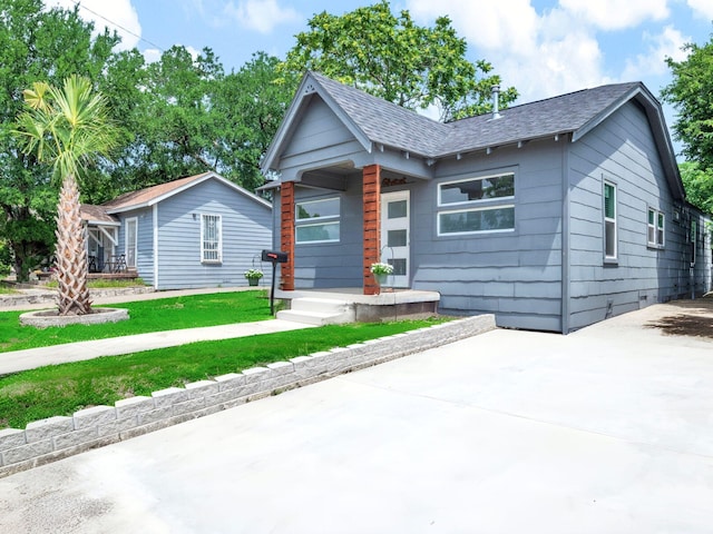 2735 Grafton Ave, Dallas, TX 75211 - view of front of property featuring a shingled roof and a front yard