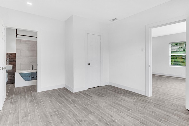 2735 Grafton Ave, Dallas, TX 75211 - spare room with light wood-style floors and baseboards