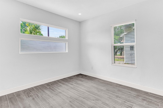 2735 Grafton Ave, Dallas, TX 75211 - unfurnished room featuring light wood-type flooring, healthy amount of natural light, and recessed lighting