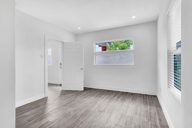 2735 Grafton Ave, Dallas, TX 75211 - empty room with wood finished floors and recessed lighting