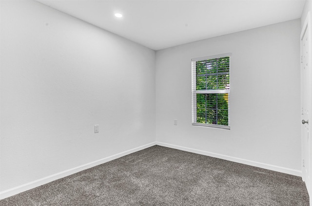 2735 Grafton Ave, Dallas, TX 75211 - unfurnished room featuring dark carpet and recessed lighting