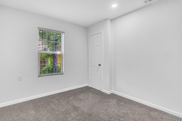 2735 Grafton Ave, Dallas, TX 75211 - empty room with dark colored carpet and recessed lighting