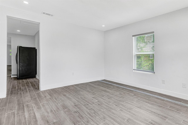 2735 Grafton Ave, Dallas, TX 75211 - spare room featuring wood finished floors and recessed lighting