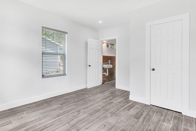 2735 Grafton Ave, Dallas, TX 75211 - unfurnished bedroom featuring wood finished floors and recessed lighting