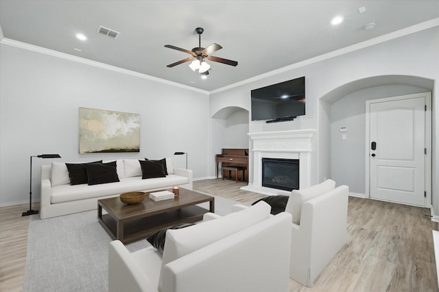 2460 Sunderland Ln, Lewisville, TX 75067 - living room featuring ornamental molding, a ceiling fan, light wood-style floors, baseboards, and recessed lighting