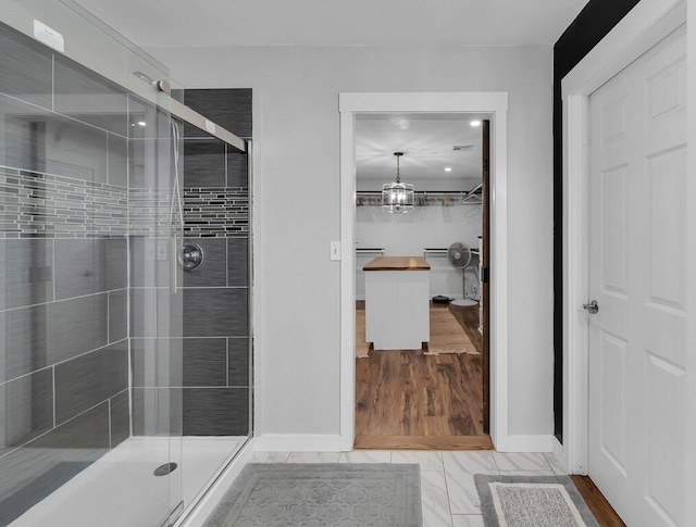 1835 Fort Graham Rd, Waco, TX 76705 - bathroom featuring a shower stall, baseboards, and a spacious closet