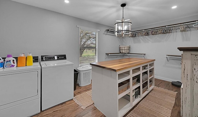 1835 Fort Graham Rd, Waco, TX 76705 - washroom with washing machine and clothes dryer, wood finished floors, a chandelier, and recessed lighting