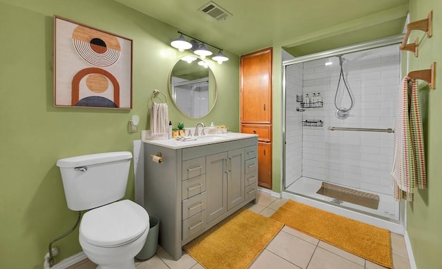 1835 Fort Graham Rd, Waco, TX 76705 - full bathroom featuring vanity, a shower stall, tile patterned floors, toilet, and baseboards