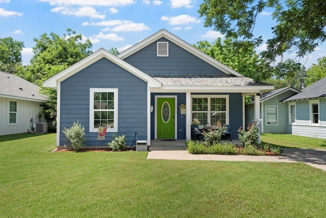 2915 Ethel Ave, Waco, TX 76707 - view of front of house featuring a front yard, covered porch, central AC, and roof with shingles
