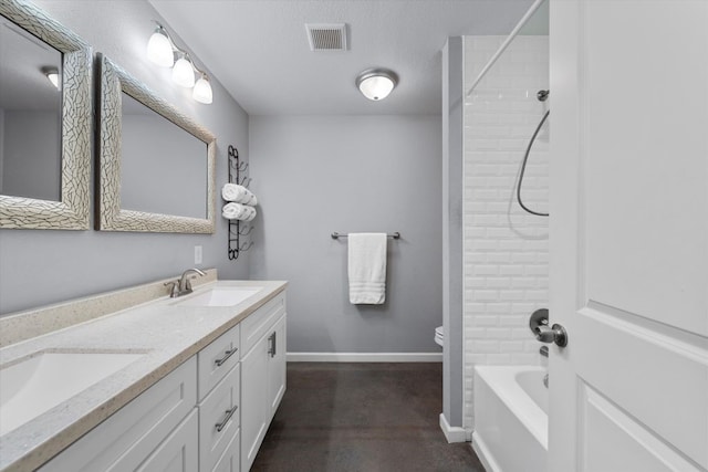 2915 Ethel Ave, Waco, TX 76707 - bathroom featuring double vanity, baseboards, shower / bathtub combination, toilet, and concrete floors