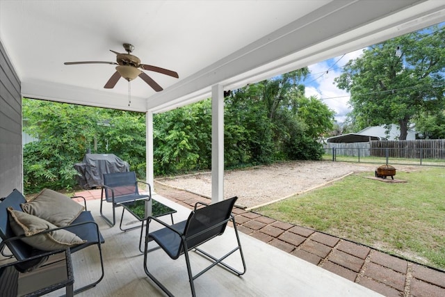 2915 Ethel Ave, Waco, TX 76707 - view of patio featuring an outdoor fire pit, a grill, a ceiling fan, and a detached carport