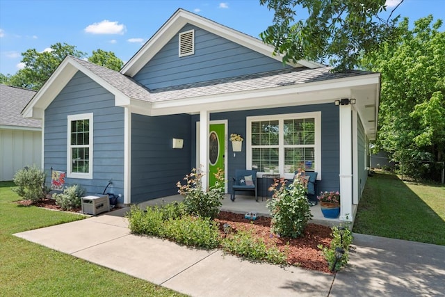 2915 Ethel Ave, Waco, TX 76707 - view of front facade with covered porch, a shingled roof, and a front yard