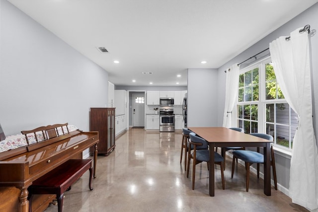 2915 Ethel Ave, Waco, TX 76707 - dining area featuring recessed lighting and concrete flooring