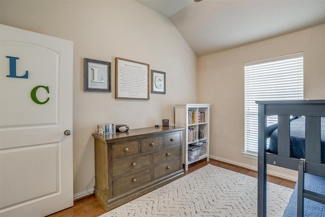 320 Westgate Dr, Aledo, TX 76008 - bedroom with vaulted ceiling, wood finished floors, and baseboards