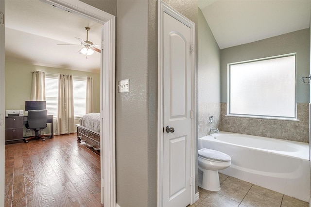 320 Westgate Dr, Aledo, TX 76008 - bathroom with a bath, ensuite bath, ceiling fan, and toilet