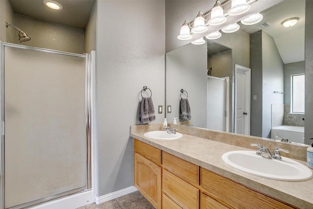 320 Westgate Dr, Aledo, TX 76008 - bathroom with a shower stall, tile patterned floors, double vanity, a textured wall, and a bath