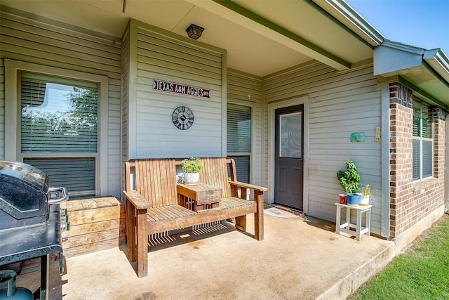 320 Westgate Dr, Aledo, TX 76008 - doorway to property featuring covered porch and brick siding
