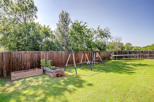 320 Westgate Dr, Aledo, TX 76008 - view of yard featuring a playground, a vegetable garden, and a trampoline