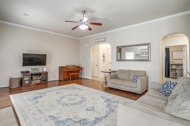 320 Westgate Dr, Aledo, TX 76008 - living room featuring arched walkways, ceiling fan, ornamental molding, wood finished floors, and baseboards