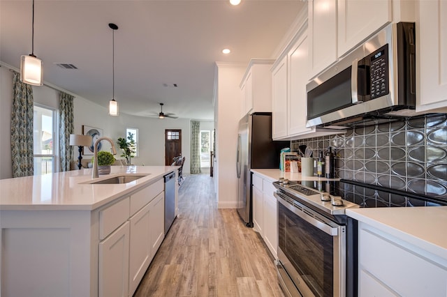 603 E Midway, Euless, TX 76039 - kitchen featuring stainless steel appliances, a sink, backsplash, white cabinets, and recessed lighting