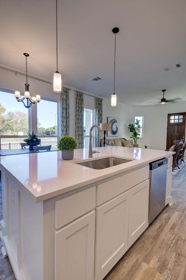 603 E Midway, Euless, TX 76039 - kitchen featuring stainless steel dishwasher, a sink, open floor plan, and light wood-style flooring
