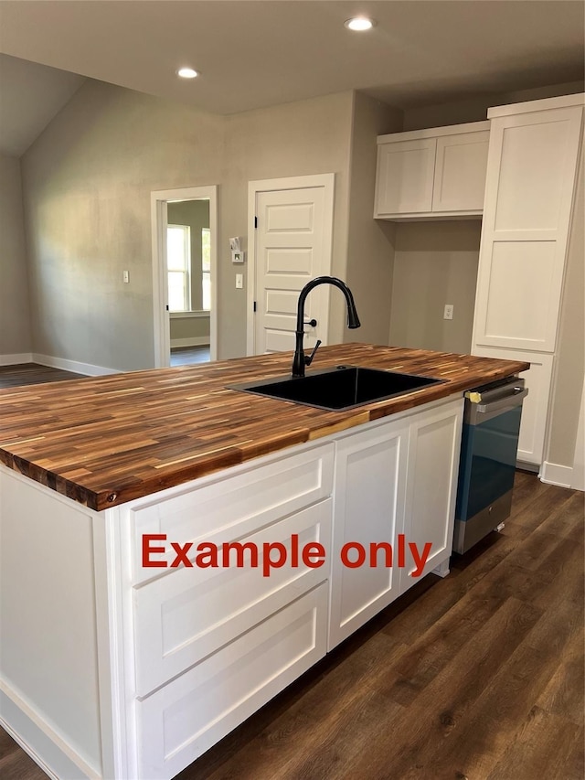 822 Rose St, Merkel, TX 79536 - kitchen featuring butcher block countertops, a sink, dark wood-type flooring, white cabinets, and dishwasher
