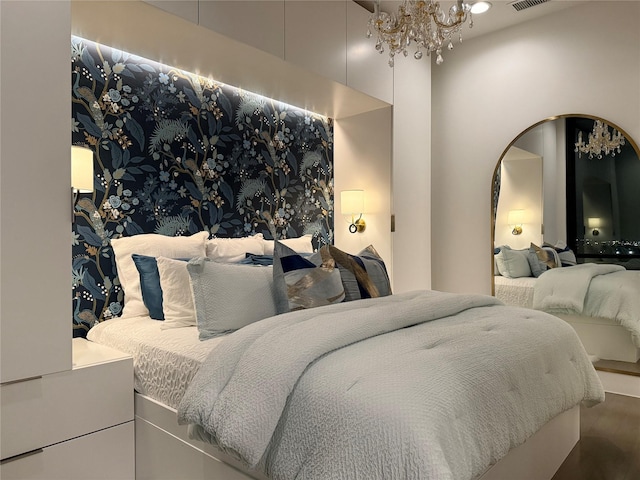 2200 Victory Ave Unit 2306, Dallas, TX 75219 - bedroom featuring arched walkways, a chandelier, and wood finished floors