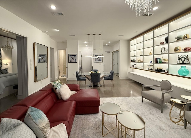 2200 Victory Ave Unit 2306, Dallas, TX 75219 - living room featuring a chandelier, wood finished floors, baseboards, and recessed lighting
