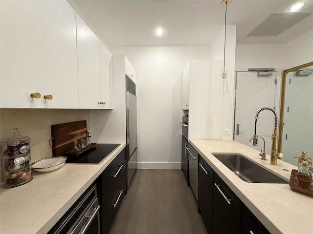 2200 Victory Ave Unit 2306, Dallas, TX 75219 - kitchen featuring a sink, dark cabinetry, white cabinetry, modern cabinets, and baseboards
