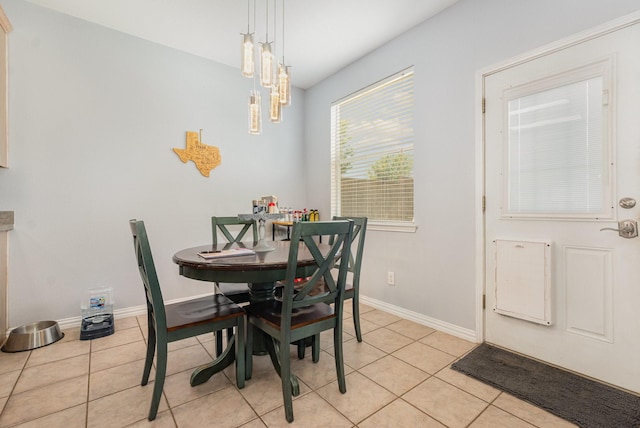 2344 Magnolia Dr, Little Elm, TX 75068 - dining room featuring light tile patterned floors, a chandelier, and baseboards