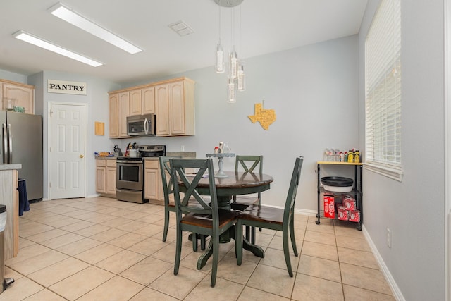 2344 Magnolia Dr, Little Elm, TX 75068 - dining room with light tile patterned floors and baseboards