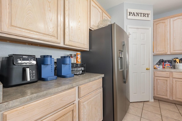 2344 Magnolia Dr, Little Elm, TX 75068 - kitchen with light brown cabinets, stainless steel refrigerator with ice dispenser, and light countertops
