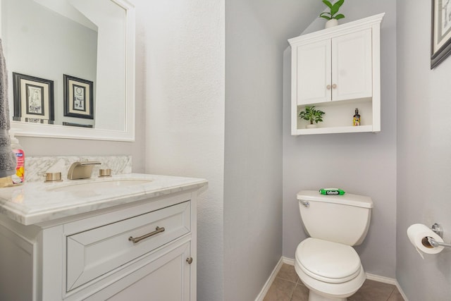 2344 Magnolia Dr, Little Elm, TX 75068 - bathroom with vanity, toilet, tile patterned flooring, and baseboards