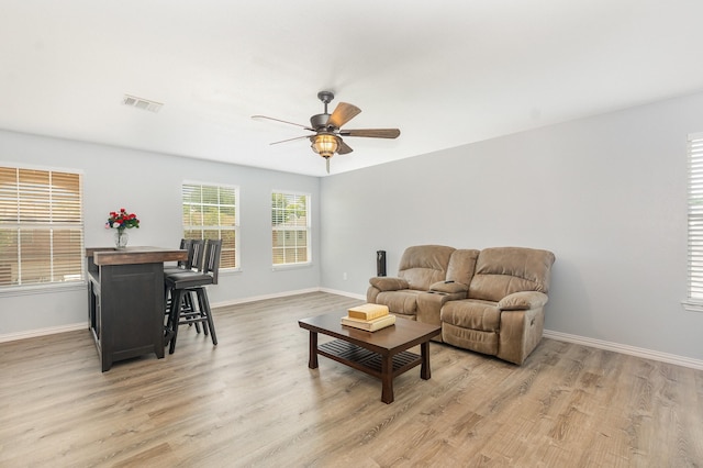 2344 Magnolia Dr, Little Elm, TX 75068 - living area featuring a ceiling fan, baseboards, and light wood-type flooring