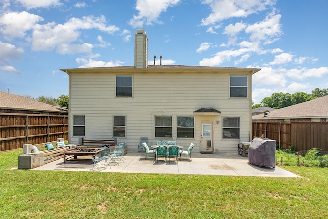 2344 Magnolia Dr, Little Elm, TX 75068 - back of house with a patio area, an outdoor fire pit, and a chimney