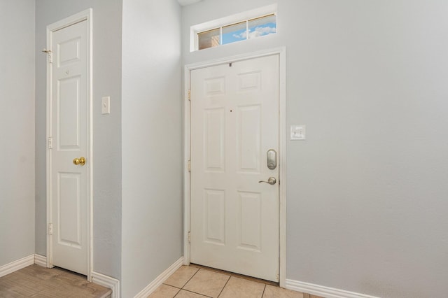 2344 Magnolia Dr, Little Elm, TX 75068 - entryway with baseboards and light tile patterned floors