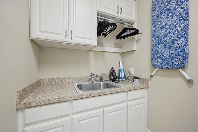 415 Fountainview Dr, Irving, TX 75039 - kitchen featuring a sink, white cabinets, and light countertops