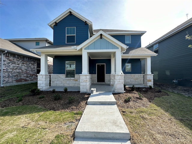 123 Monarch Way, Wylie, TX 75098 - craftsman house with a porch, stone siding, and board and batten siding